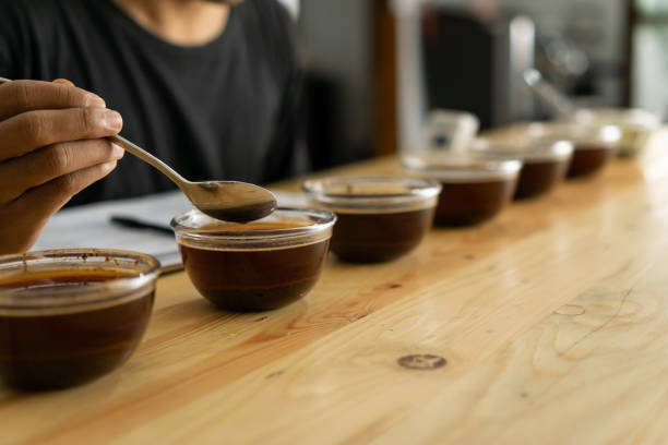 Coffee beans roasting process. the process of cupping black espresso Americano coffee which has gone through roasting, quality control and brewing processes