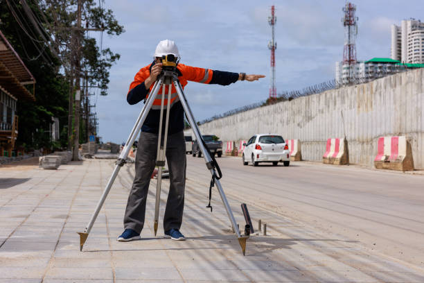 istock engineer use theodolite equipment working on construction site for route surveying 1716963195