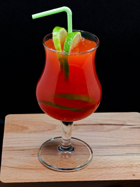 istock red cocktail decorated with lime on a black background 1716964265
