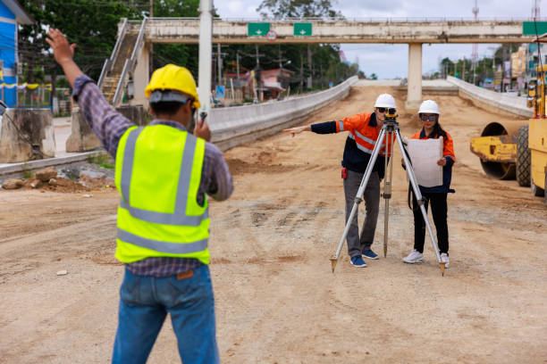 istock Engineer use theodolite equipment for route surveying to build a bridge 1716965482