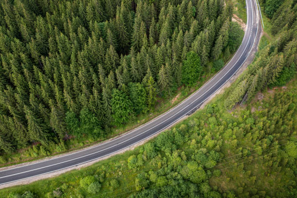 istock Road curve in mountains aerial view 1716971653