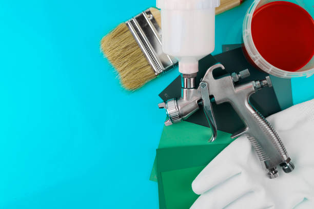 istock Paint spray gun at work at the workplace in the workshop. Paint Brush 1716975582