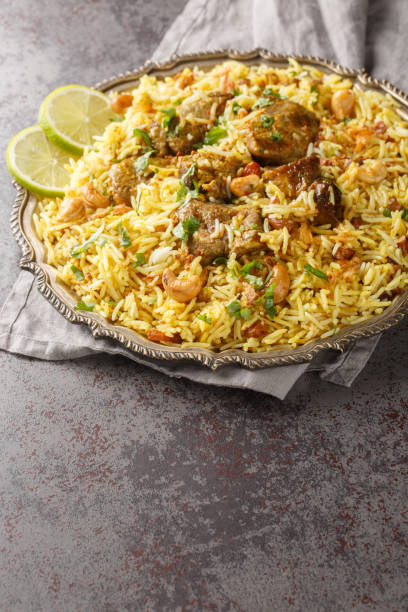 istock Kacchi Mutton Biryani is a delicious rice dish where tender lamb meat pieces are marinated with lots of spicy closeup on the plate. Vertical 1716976808