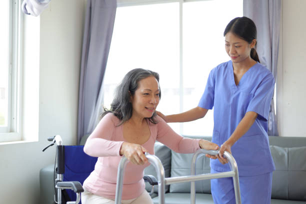 istock Female doctor help a senior patient who is doing physical therapy and is practicing walking with a walking stick. 1716977428
