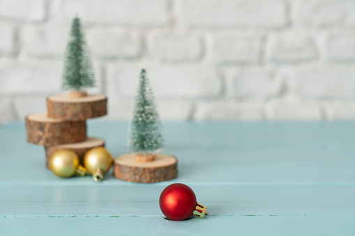 Christmas tree and decor xmas ball on white table and wall background.clean minimal simple style.holiday still life mockup to display design