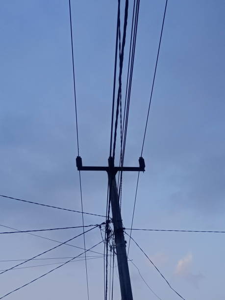 istock background of electricity poles with blue sky 1717009670