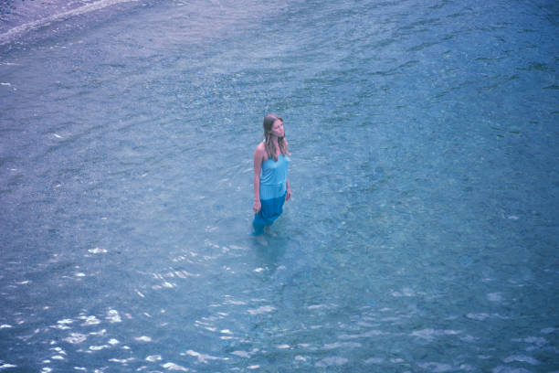 beautiful young girl alone in nature. contemplative mode, emotional outlook and balance