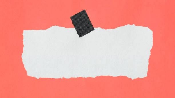 istock Teared paper with tape and orange background 1717023305