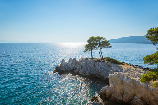 Amarandos cove Three trees (Mamma Mia!), Skopelos island, Sporades, Greece at sunset.