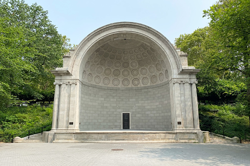 The Public Music Shell Stage is an iconic outdoor performance venue located in Central Park, in the heart of Manhattan, New York City. This renowned stage hosts a variety of musical events and concerts, providing a unique and vibrant cultural experience in the bustling metropolis of NYC.