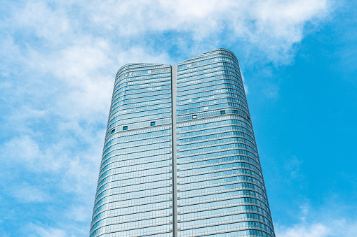 Black and white reflection of office buildings on the glass wall, background with copy space, full frame horizontal composition