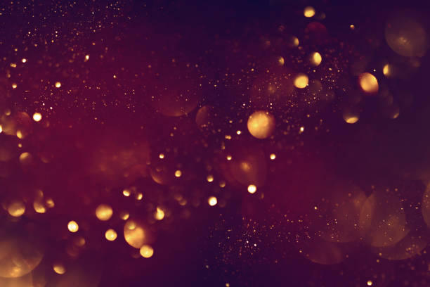 istock Golden abstract bokeh on black background. 1717034367