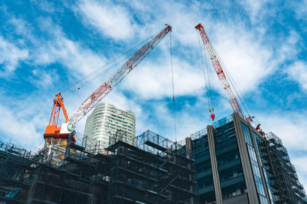 istock Construction with cranes in Tokyo City 1717037192
