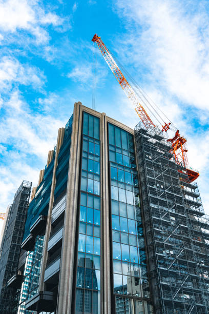istock Construction with cranes in Tokyo City 1717039988