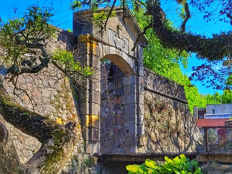 imposing entrance portal in the old stone wall in the historic center of Colonia del Sacramento in Uruguay