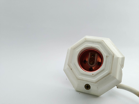 View of lamp socket on white background