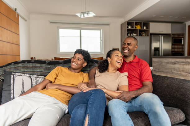 istock Family watching TV at home 1717049698