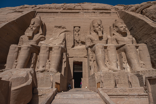 Abu Simbel, Aswan , Egypt - January 31, 2023: Abu Simbel is a historic site comprising two massive rock-cut temples in the village of Abu Simbel. It is situated on the western bank of Lake Nasser, about 230 km (140 mi) southwest of Aswan. The twin temples were originally carved out of the mountainside in the 13th century BC, during the 19th Dynasty reign of the Pharaoh Ramesses II. They serve as a lasting monument to Ramesses II.
