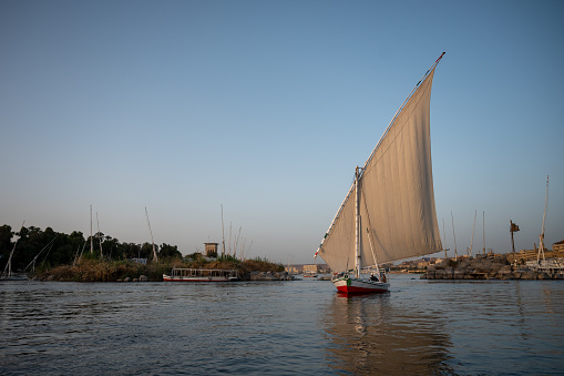 View of a felucca sailing on the Nile River in Aswan, Egypt