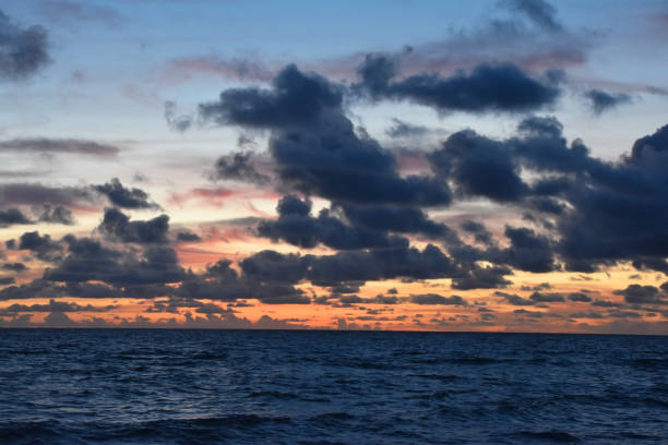 istock Sunrise over the sea, beautiful cloudscape 1717061683