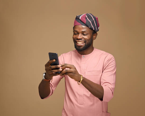 istock African man celebrates after receiving an email isolated white background 1717063394