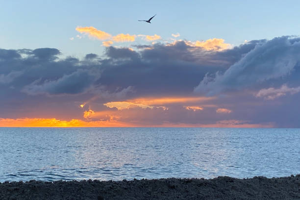 istock Sunrise over the sea, beautiful cloudscape 1717068063