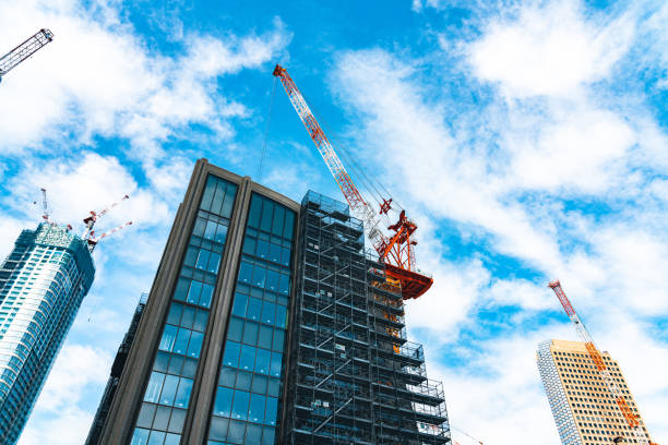 istock Construction with cranes in Tokyo City 1717070347