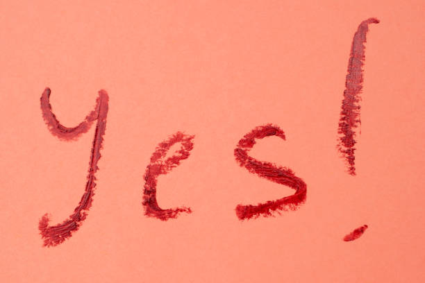 istock Yes ! - red lipstick lettering on pink 1717073640