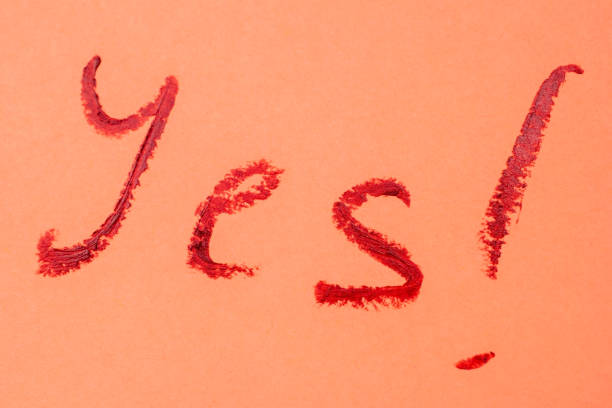 istock Yes ! - red lipstick lettering on pink 1717074095