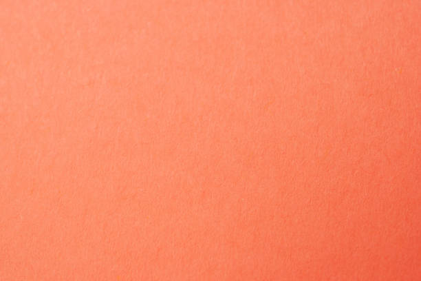 istock Peachy orange pink cardboard texture, coral salmon background 1717075265