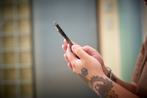 Woman using smart phone with green screen sitting at home. Close up of hands, unrecognizable person. It’s about Marketing, Mobile App,Communication,Connection,Lifestyles,Modern,Technology,Togetherness,Wireless Technology, Zoom Effect.