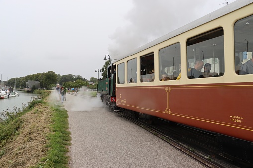 On August 31th 2023, Saint Valery Sur Somme, Normandy in France. During the last week of summer holidays in France, tourists prefer visit the fabulous bay of Somme with an old steam train