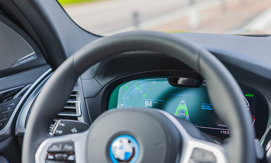 Sweden. Uppsala. 08.31.2023. View of speedometer design moving car on new BMW iX3 M-sport electric car.