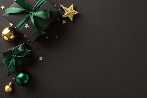 Celebrate arrival of New Year in opulent style, complete with top-view photos of deluxe black gift boxes with green bows, gold and green baubles, star ornament, confetti, black surface with ad space