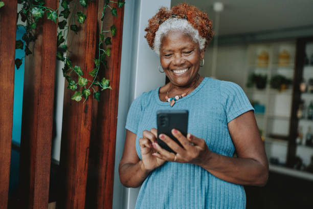 istock Portrait senior woman using smartphone smiling 1717120931