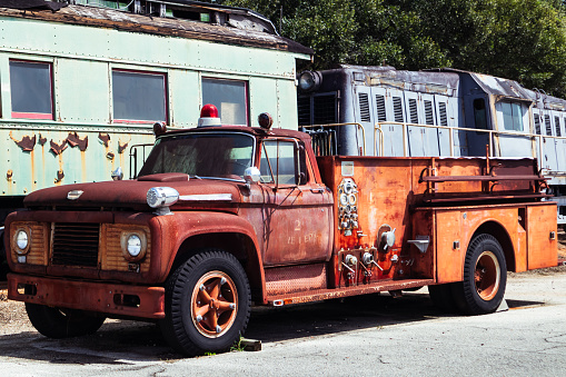This 1950's fire truck shows it's years of rusty texture after being outside.  Original red color is now rusty orange.