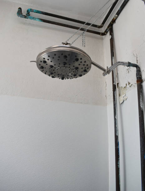 istock A large old shower head against a wall with peeling paint and rusty pipes 1717152796