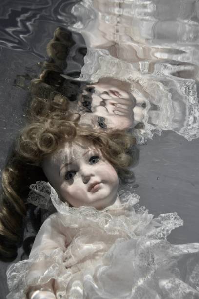 istock Spooky Doll Underwater with ruffle dress 1717160826