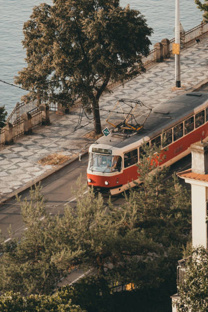 istock Prague historic tram on a promenade next to a river 1717171190