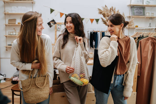 istock Smiling friends with bags in their hands 1717184693