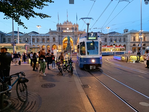 Zurich Bahnhofstrasse with Tram (Cable Car)and Pedestrians. The image was captured during autumn season at dusk.