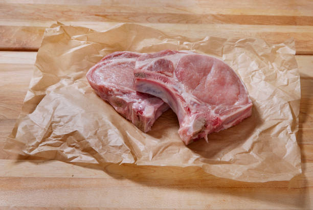 istock Raw Pork Loin Bone In Rib End Chop 1717195017