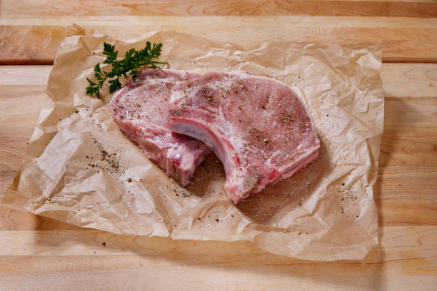 istock Seasoning Raw Pork Loin Bone In Rib End Chop 1717195309