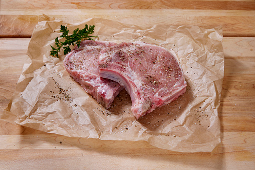 Seasoning Raw Pork Loin Bone In Rib End Chop