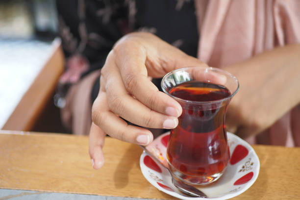 istock women drinking Traditional turkish tea on white table . 1717231293