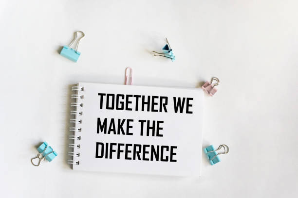 istock Text together we will change the situation on a notepad and white background 1717236188