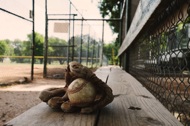 istock Baseball equipment on dugout bench for sport 1717239930