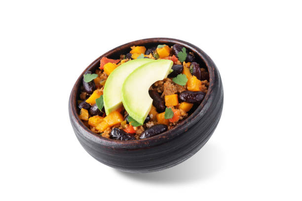 Pumpkin Chili con carne in a bowl on a white isolated background
