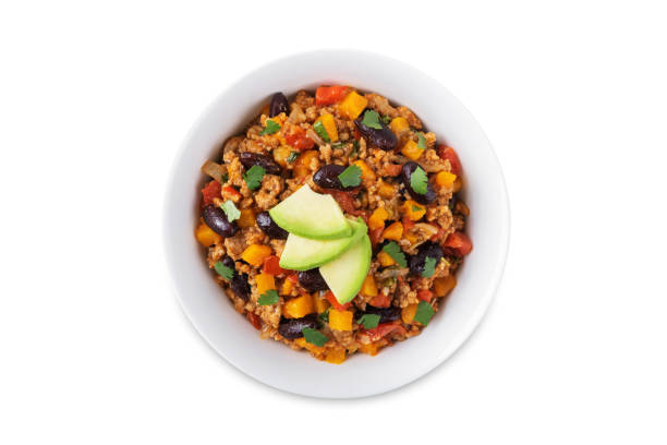 Pumpkin Chili con carne in a bowl on a white isolated background