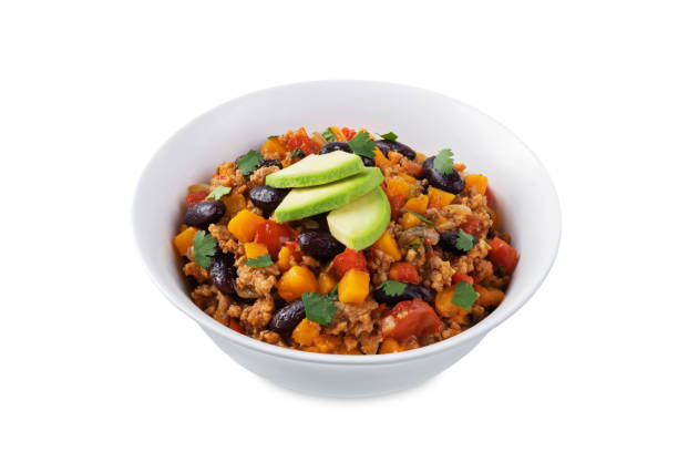 Pumpkin Chili con carne in a bowl on a white isolated background